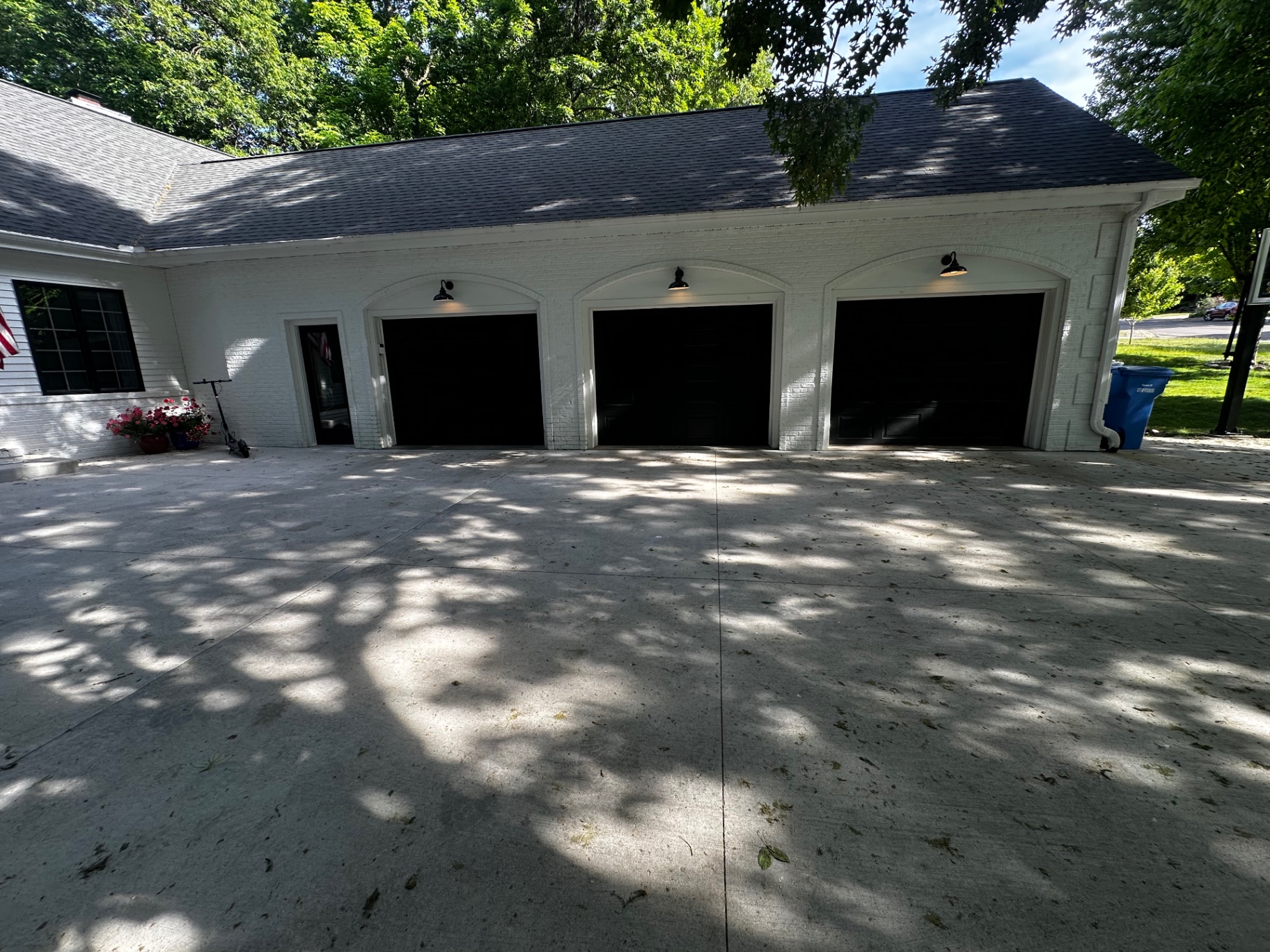 Garage driveway before pressure washing